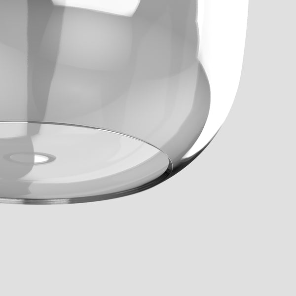 Close up of a clear glass bowl with a silver rim
