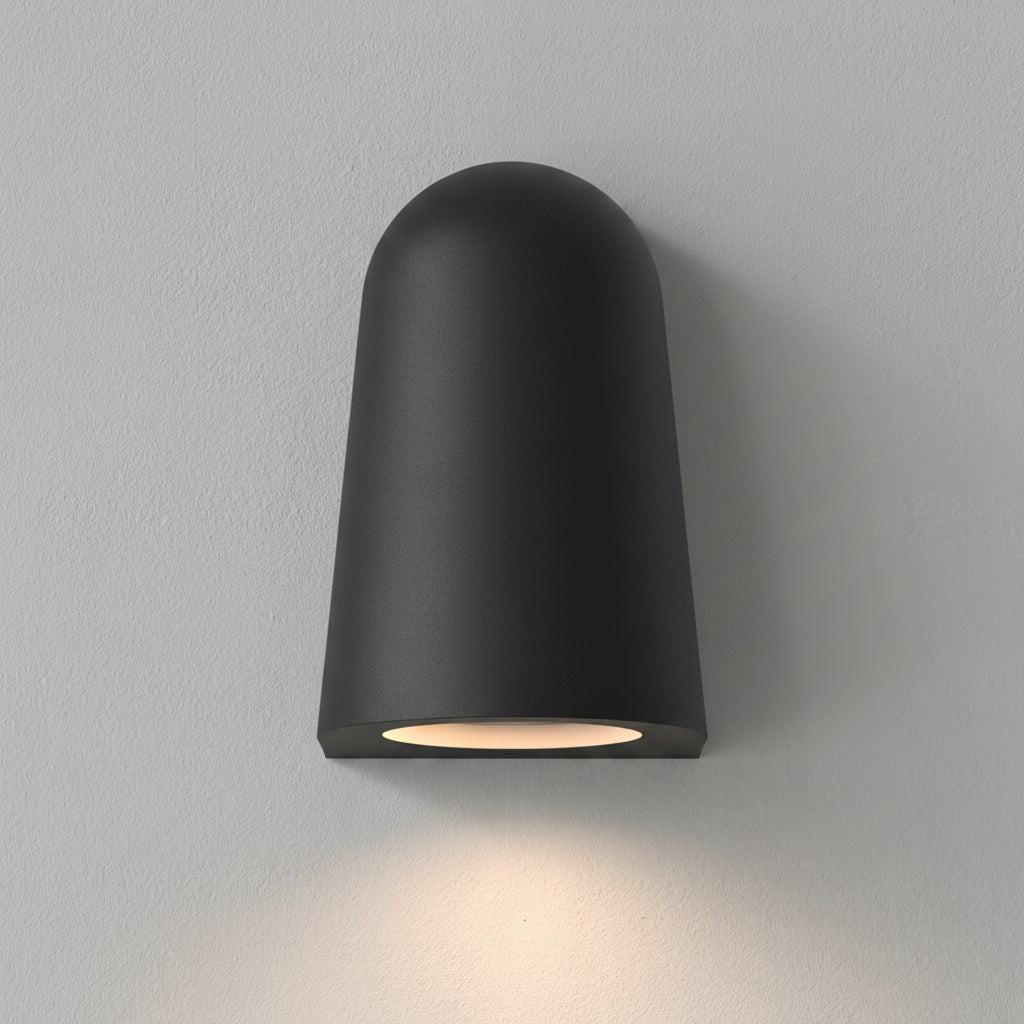 Black outdoor wall light with a rounded top and a downward-facing light
