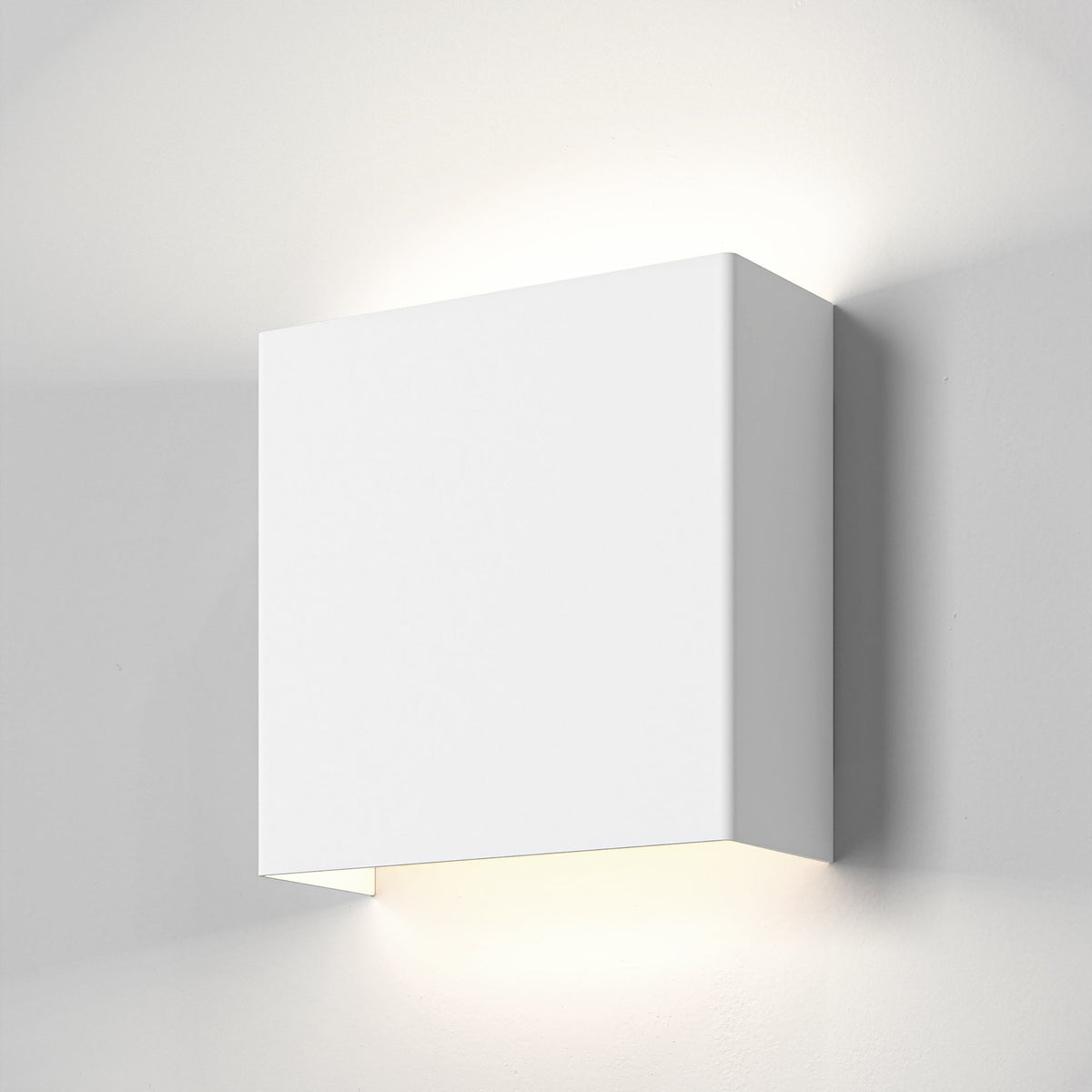 White rectangular wall light with light shining upwards and downwards