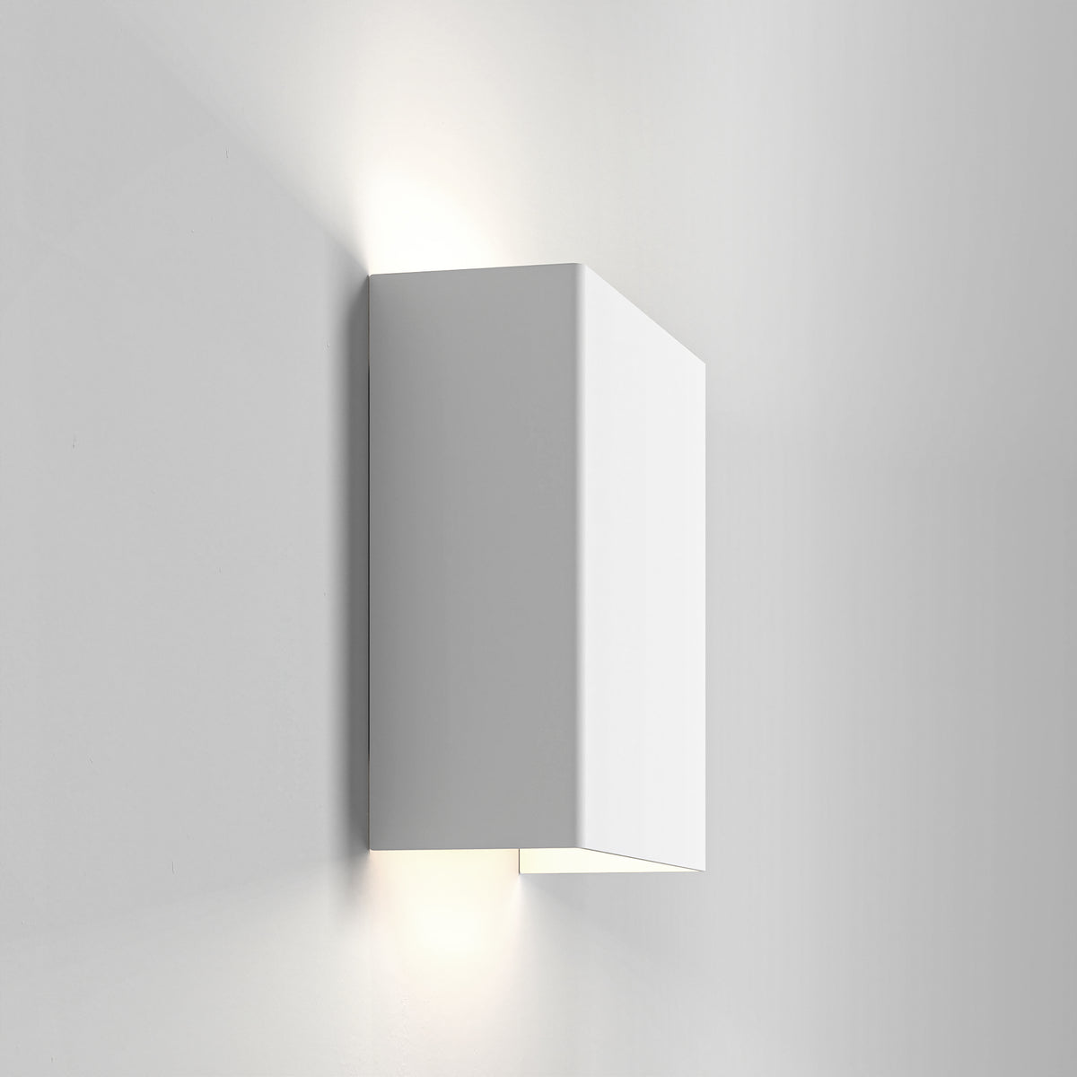 White rectangular wall light with light shining upwards and downwards