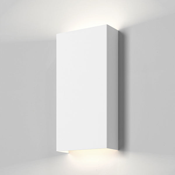White rectangular wall light fixture casting light upwards and downwards on a light grey wall