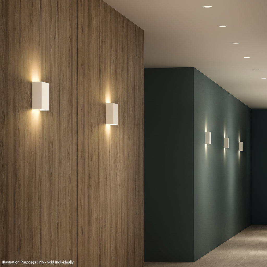 White rectangular wall lights on a wooden wall and a dark green wall