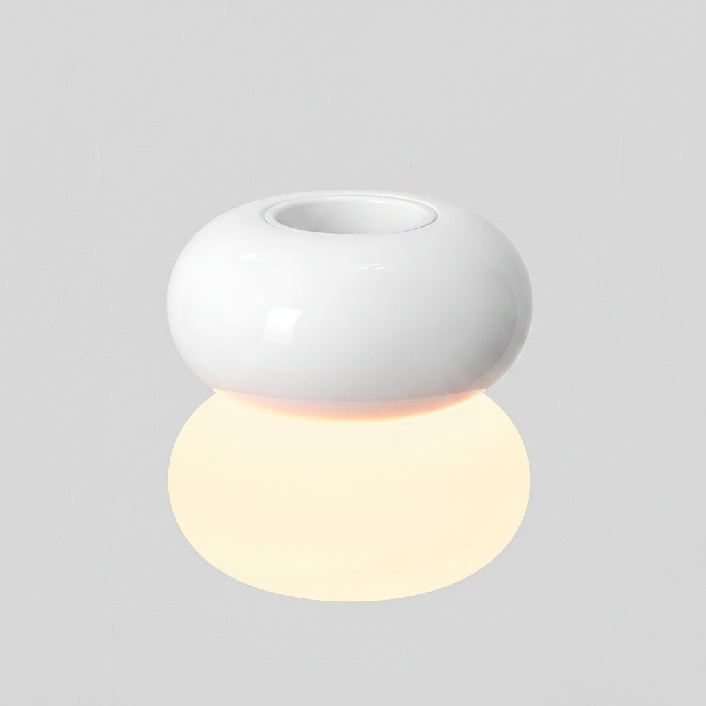 White ceramic diffuser with a glowing spherical light below it