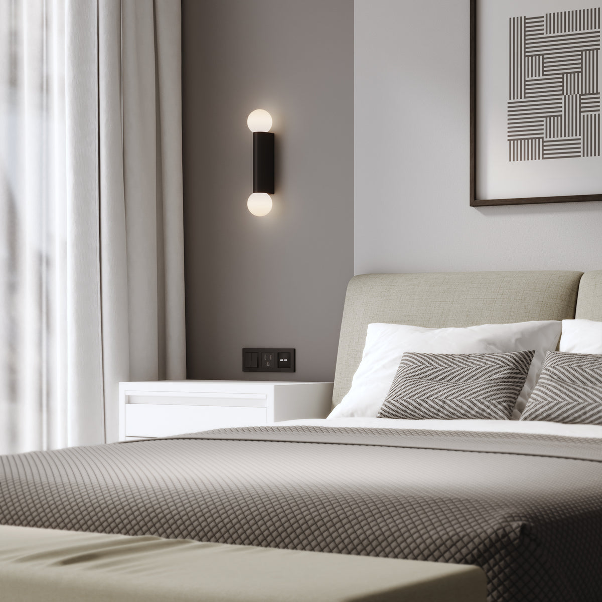 Bedroom with a bed, white nightstand, and a black wall sconce with two round bulbs