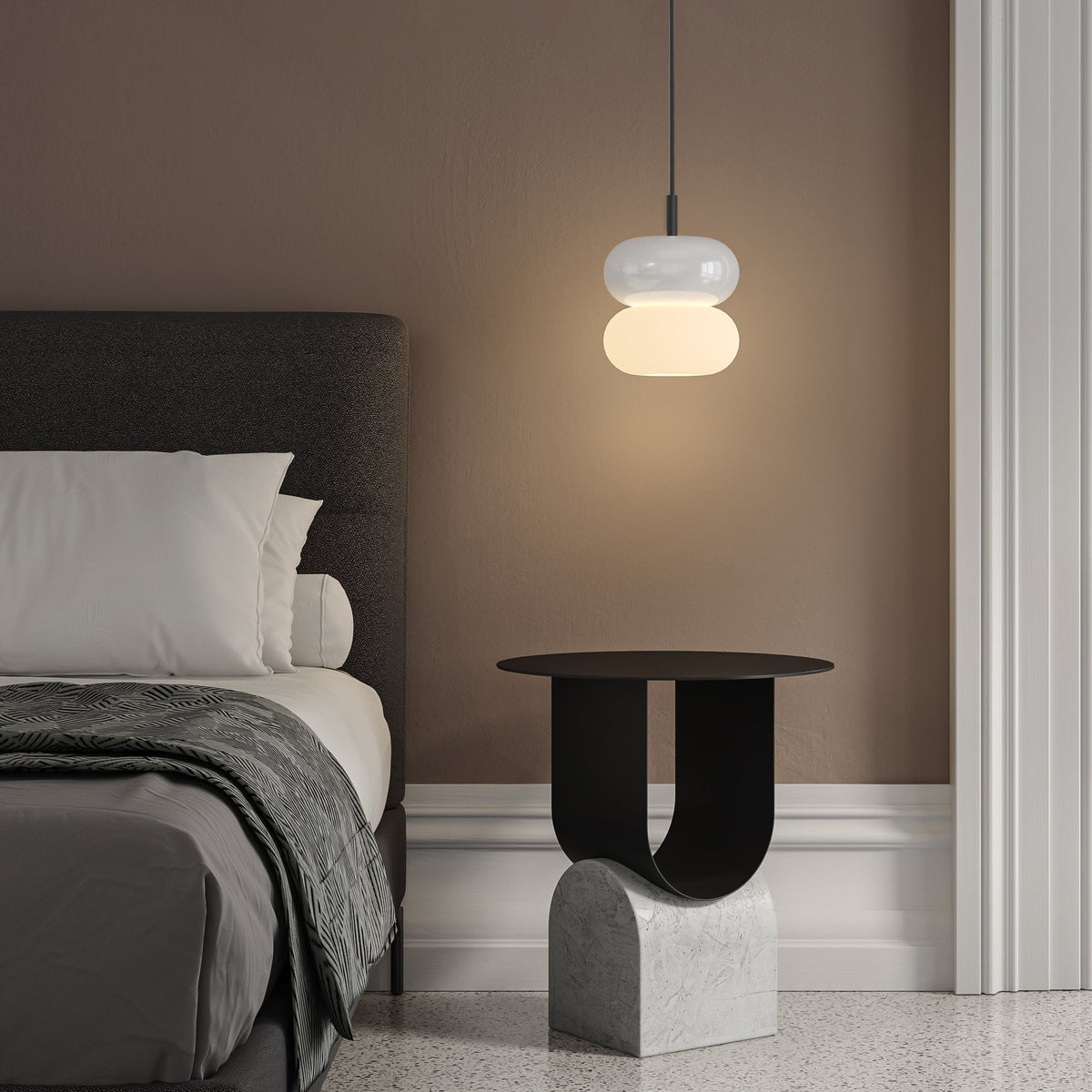 Bedroom with a bed, a side table, and a pendant light