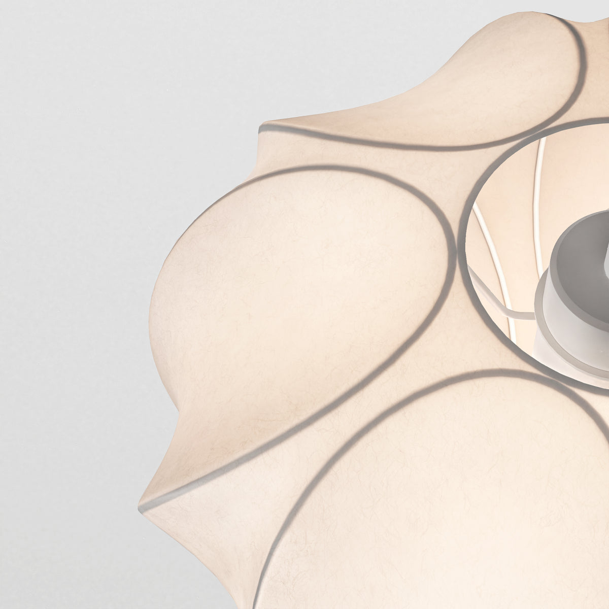 Close up of a white paper lantern with a light source inside