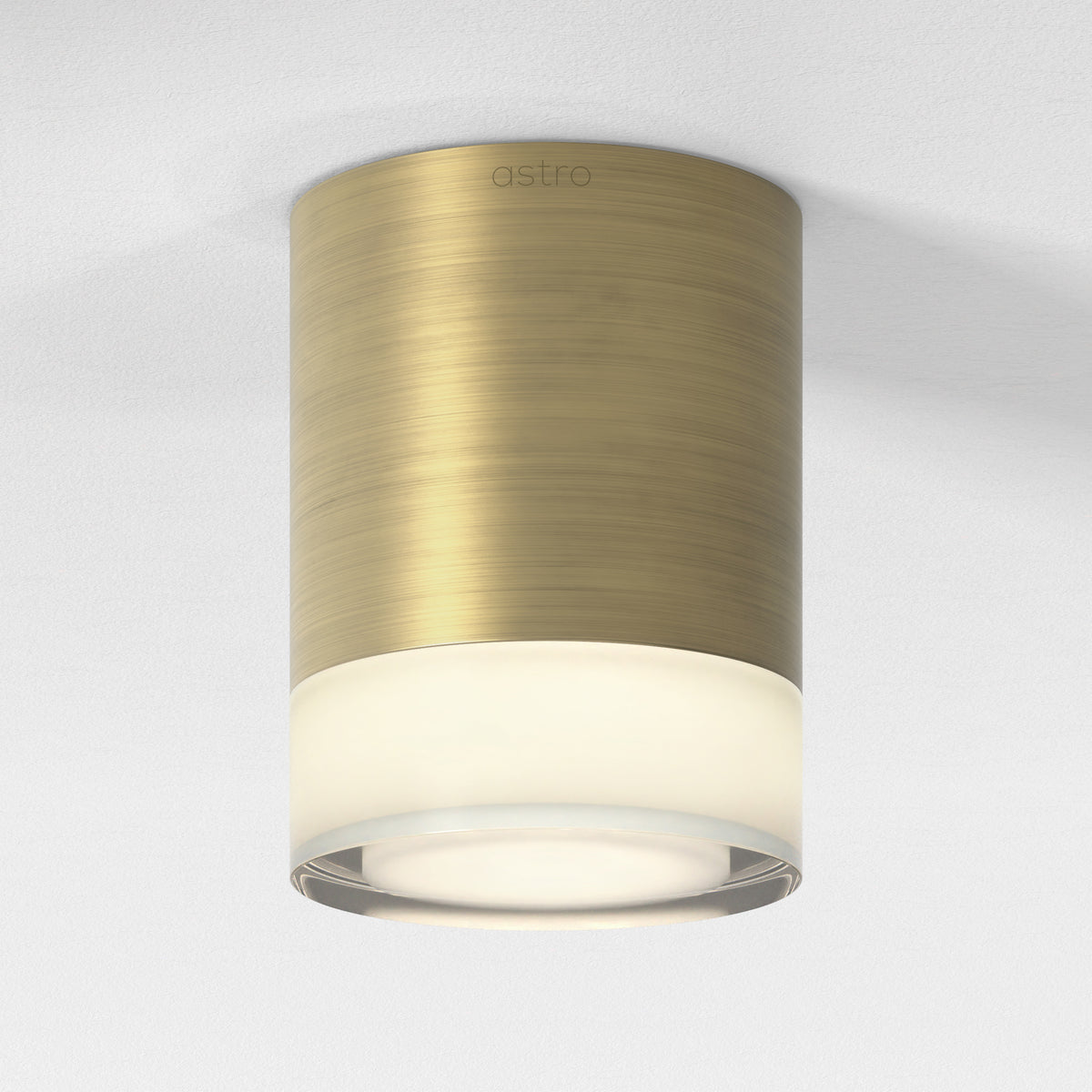 Astro ceiling light in brushed brass with a frosted glass diffuser