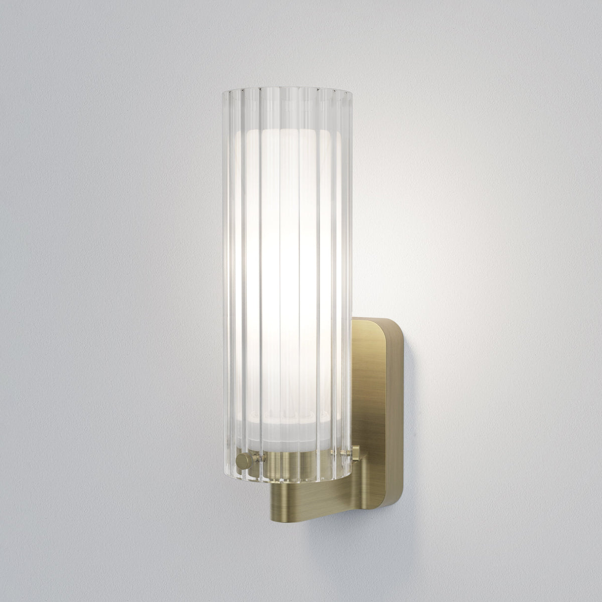 Fluted glass and brass wall light