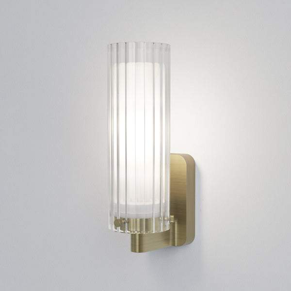 Fluted glass and brass wall light