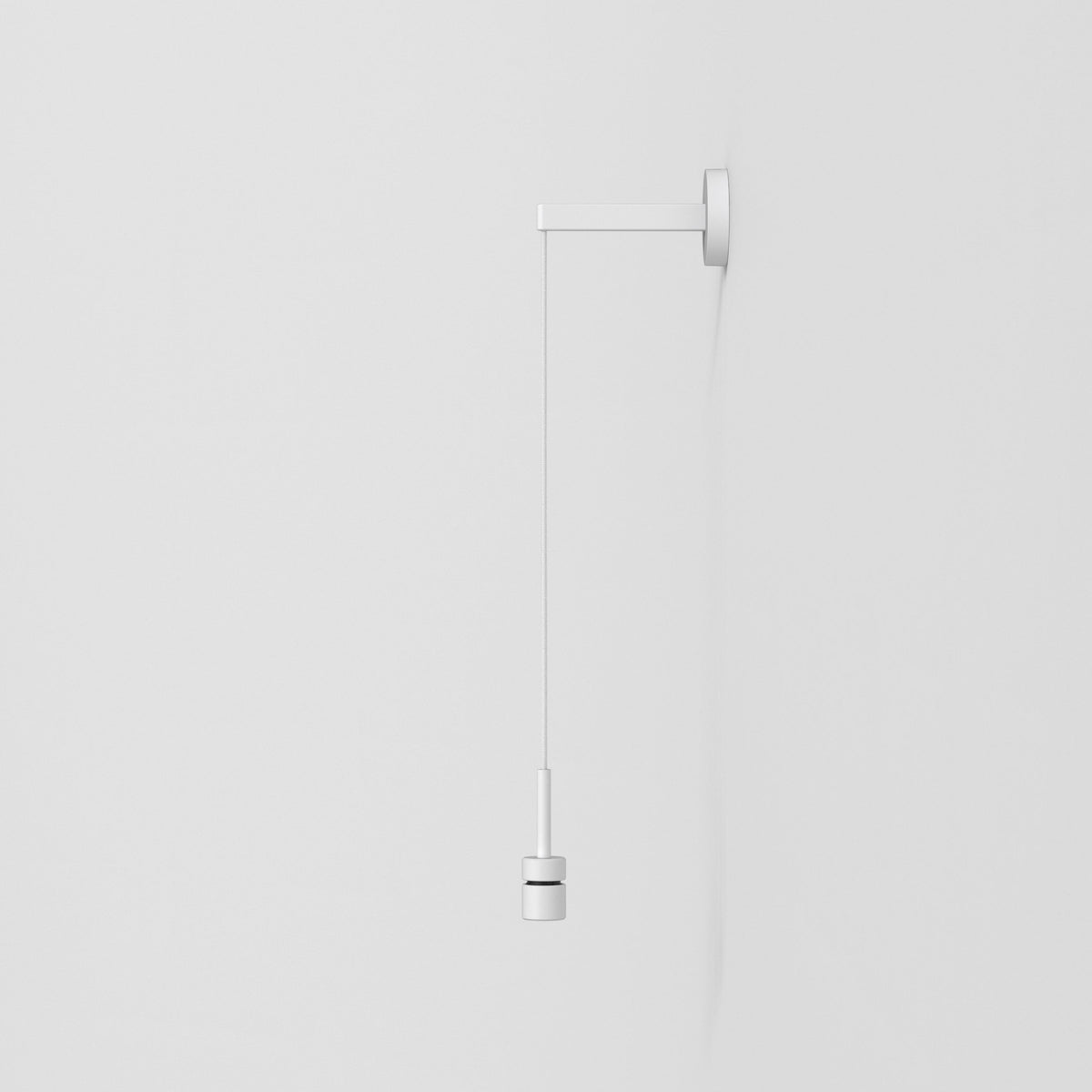 White wall-mounted light switch with a pull cord and cylindrical handle
