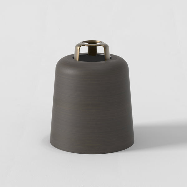 Bronze bell-shaped light fixture with a brass ring at the top