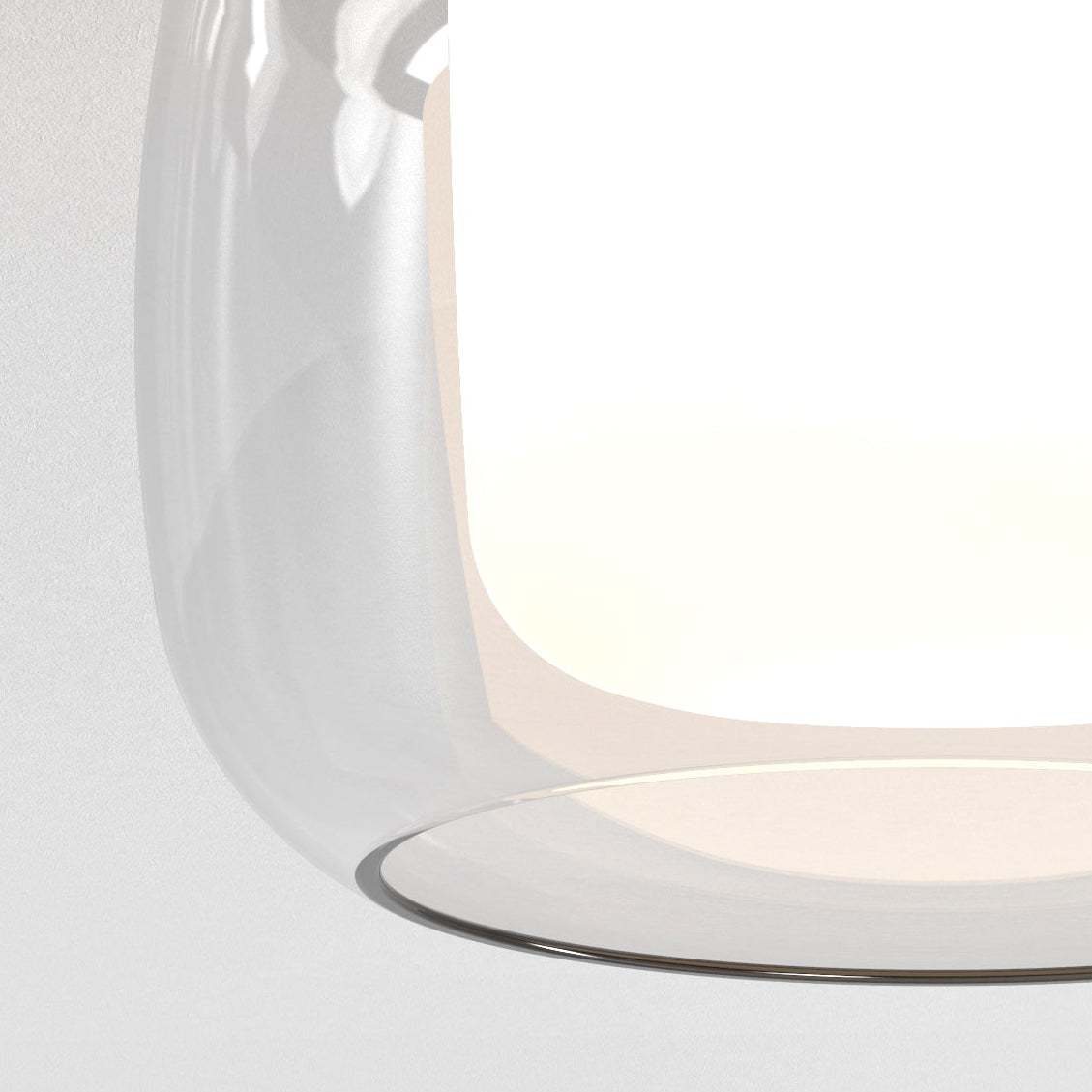 Close up of a clear glass light fixture with a white interior