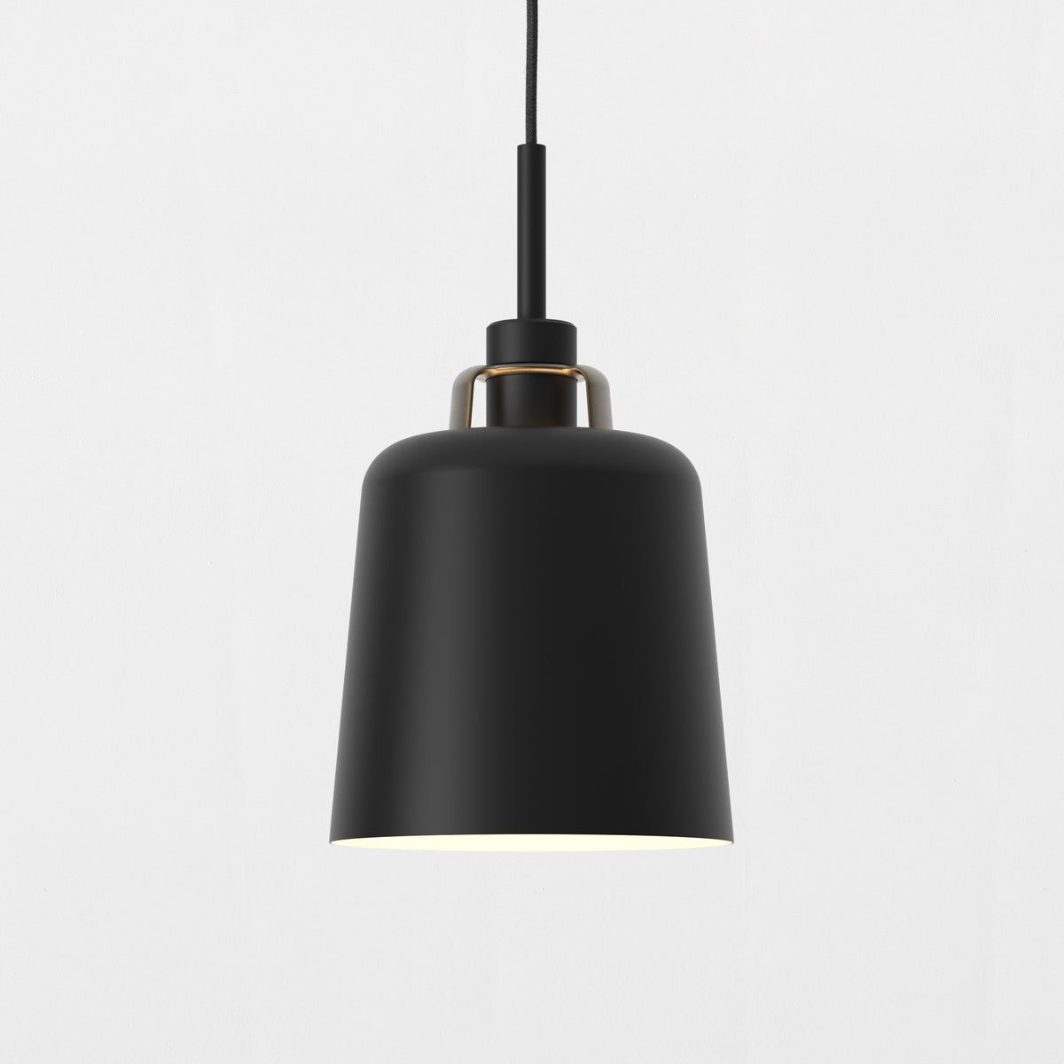 Black pendant light with a gold accent ring and a visible light source at the bottom