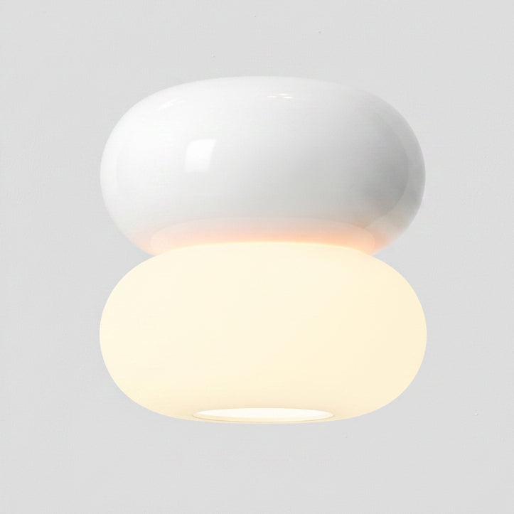 White ceiling light with two stacked oval shapes, the bottom one illuminated