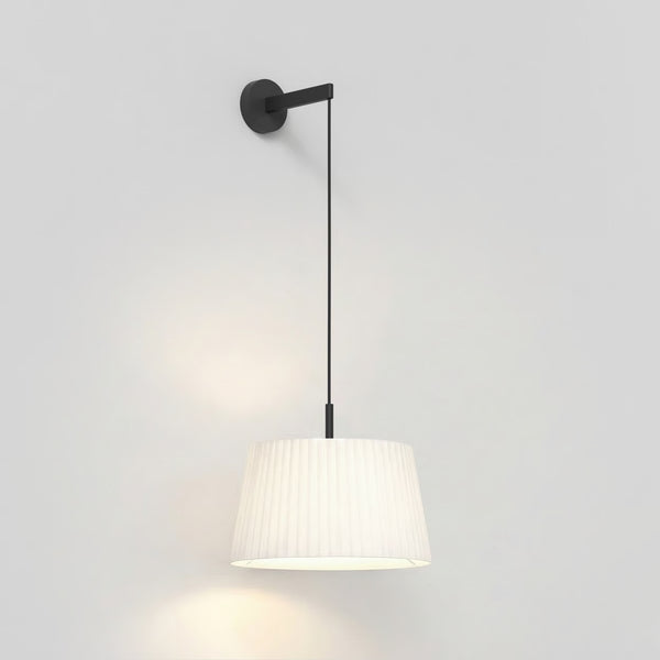 White pleated pendant light with black wall mount and cord