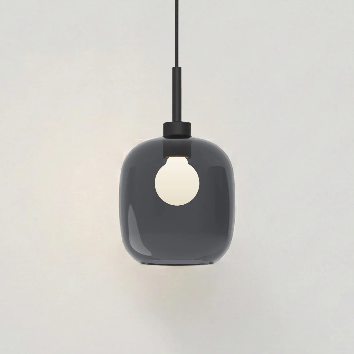 Dark grey glass pendant light with a white bulb