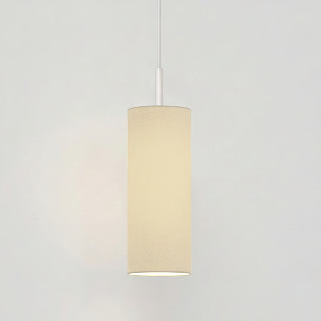 Cylindrical pendant light with a cream fabric shade