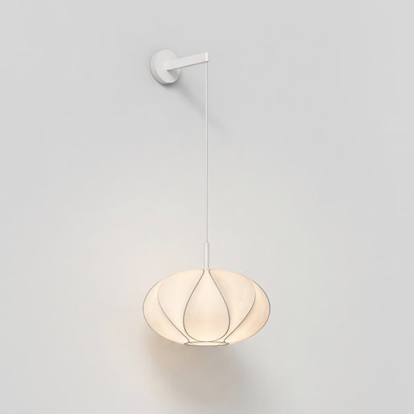 White wall lamp with a round, pleated fabric shade