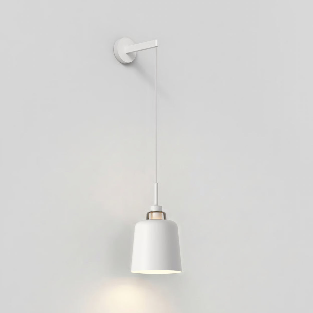 White wall lamp with a cylindrical shade and a gold accent