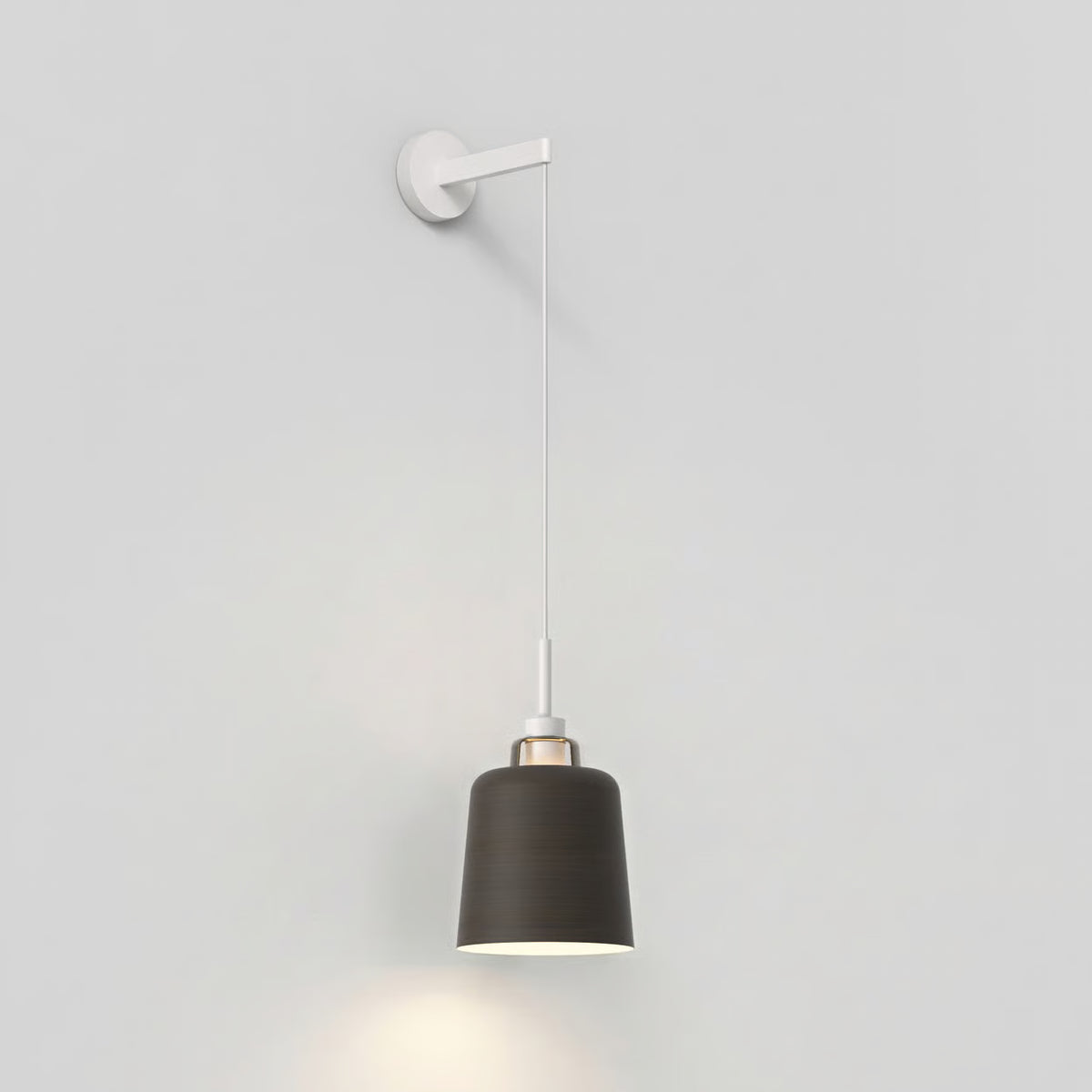 Wall-mounted pendant light with a dark grey shade and white cord