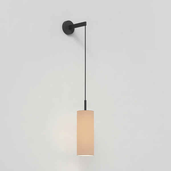Black wall-mounted light fixture with a cylindrical beige fabric shade