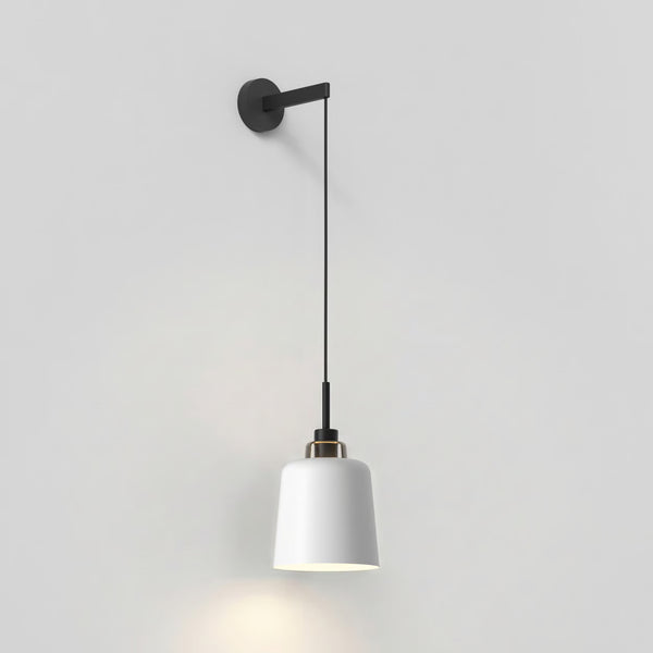 White pendant light with a black cord and wall mount