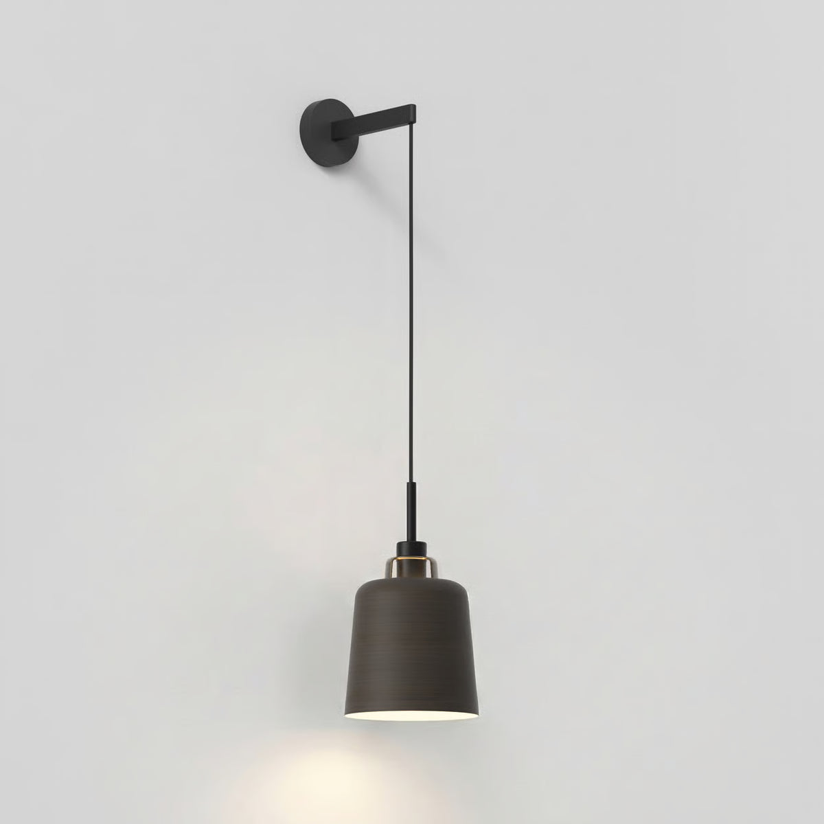 Black wall-mounted light fixture with a dark gray bell-shaped shade and a gold accent