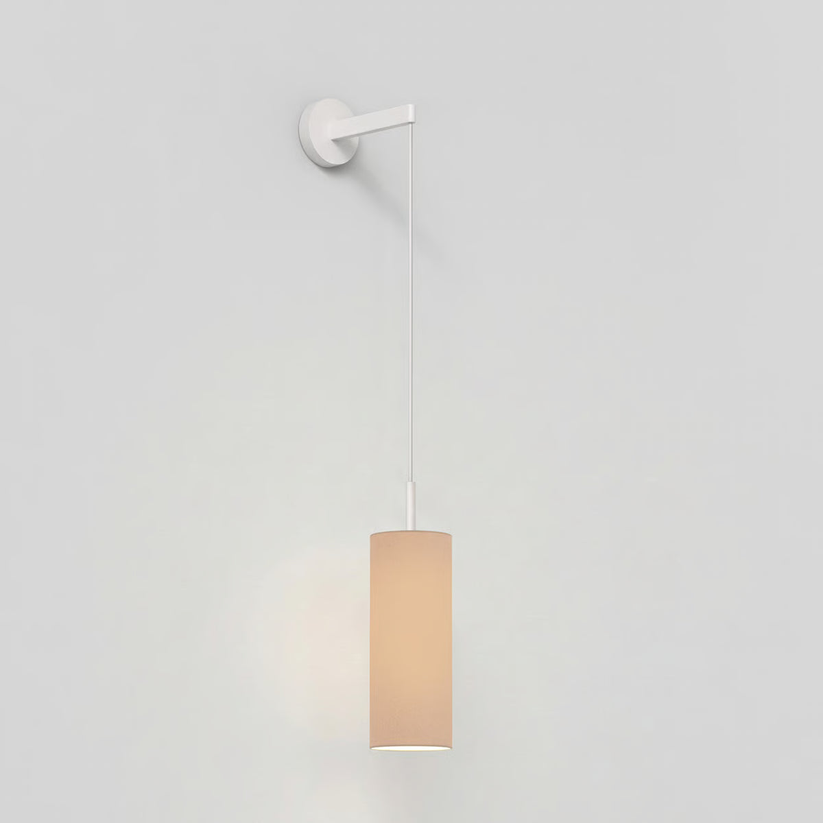 White wall light with a cylindrical beige fabric shade