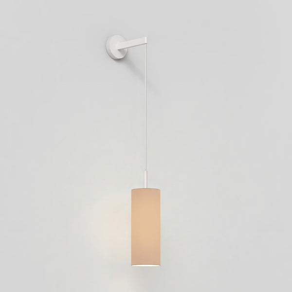 White wall light with a cylindrical beige fabric shade