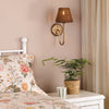 Adyara Wall Light in Antique Bronze With Tapered Brown Rattan Shade