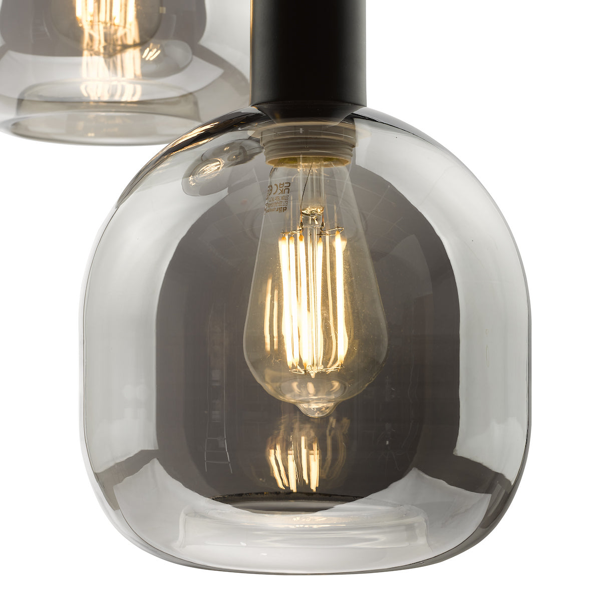 Close-up of a smoked glass pendant light with an exposed filament bulb.