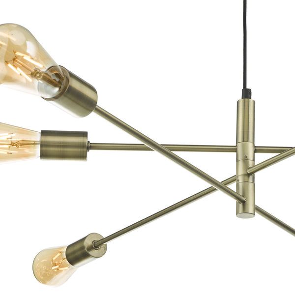 Close-up of a brass chandelier with three exposed Edison bulbs, angled on a white background.