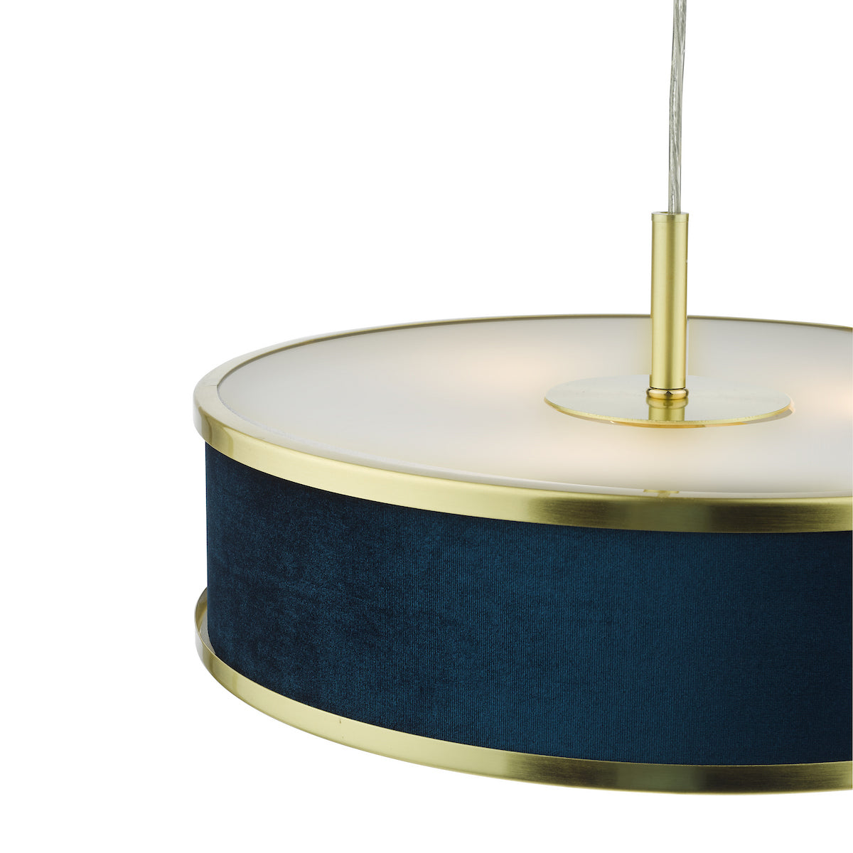 Close-up of a blue velvet and brass pendant light with a white diffuser.
