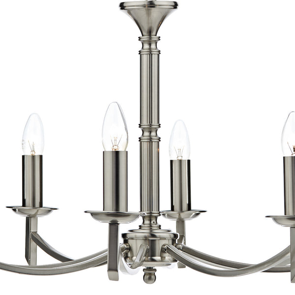Brushed nickel chandelier with four exposed candle-style bulbs.