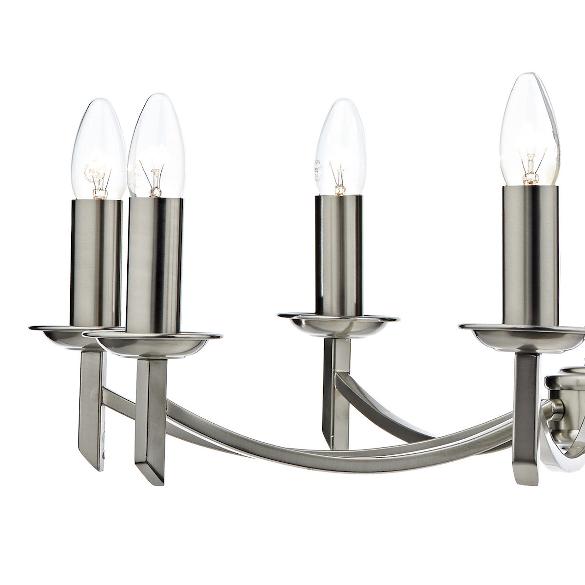 Close-up of a brushed steel chandelier with four candle-style bulbs.