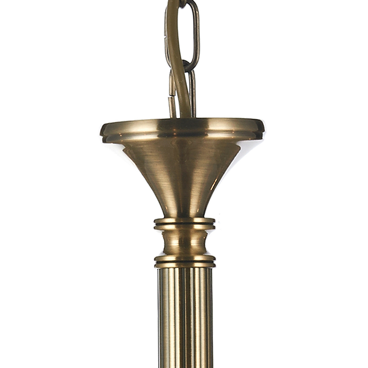 Close-up of a brass chandelier chain and decorative column.