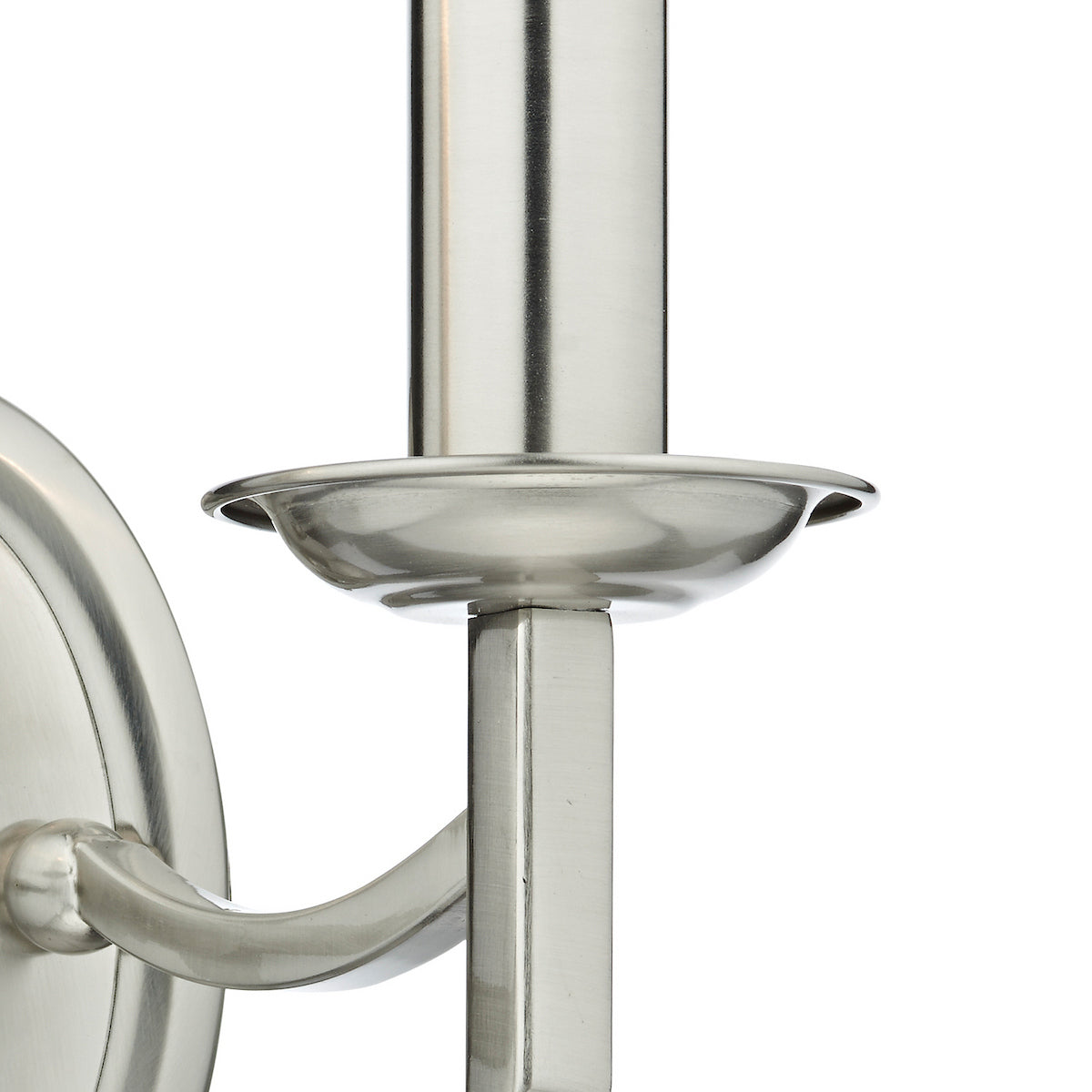 Close-up of a brushed nickel wall sconce with a candle-style bulb holder.