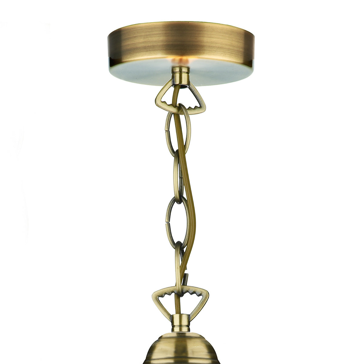 Antique brass ceiling rose with chain and cable for a pendant light fitting.