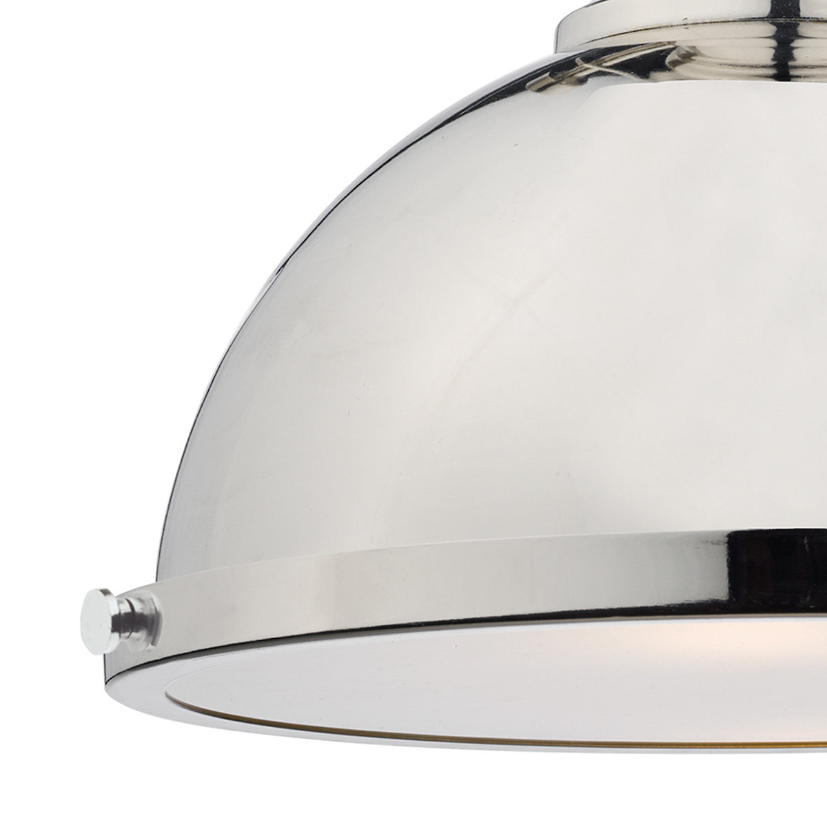 Close-up of a polished nickel dome pendant light with a subtle glow.