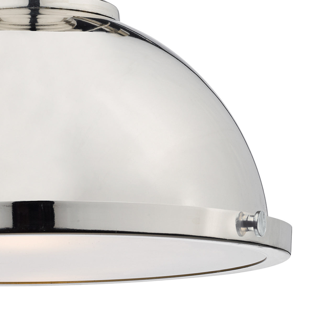 Close-up of a polished nickel pendant light with a domed shade and a visible light source.