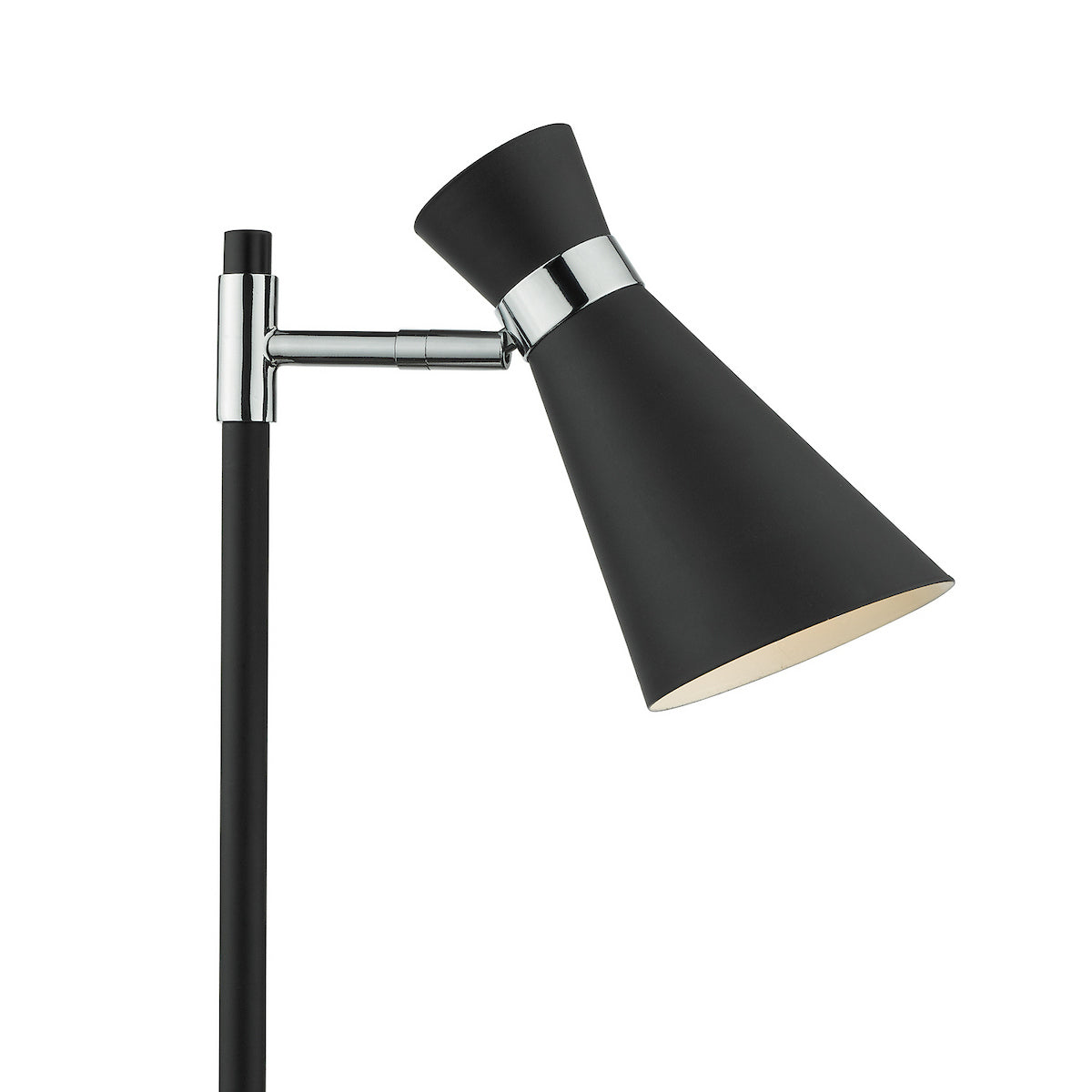 Black and chrome floor lamp with a conical shade angled downwards, emitting a warm glow.