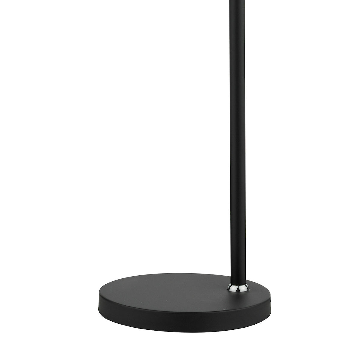 Black circular base of a floor lamp with a thin black pole extending upwards.