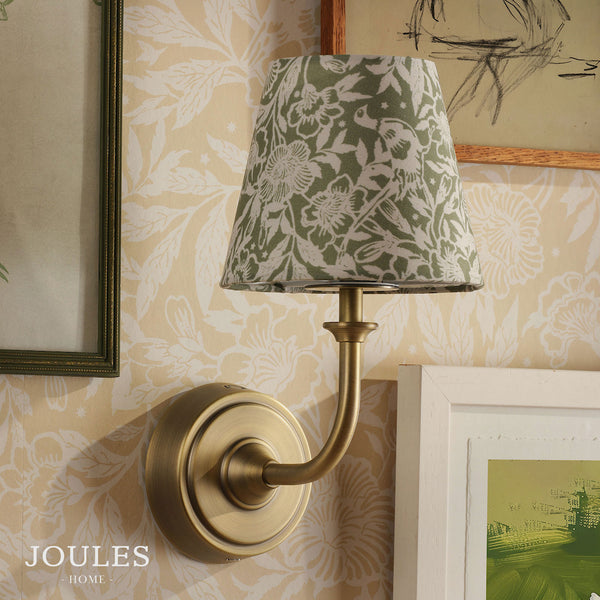 Joules Apsley rechargeable wall light in antique brass with a green floral cotton shade