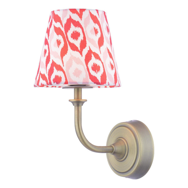 Wall lamp with antique brass finish and red patterned fabric shade