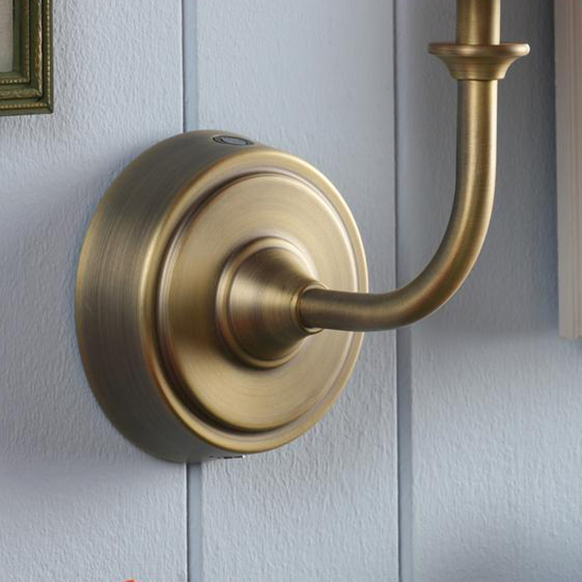 Joules Apsley rechargeable wall light in matt antique brass finish mounted on a wall