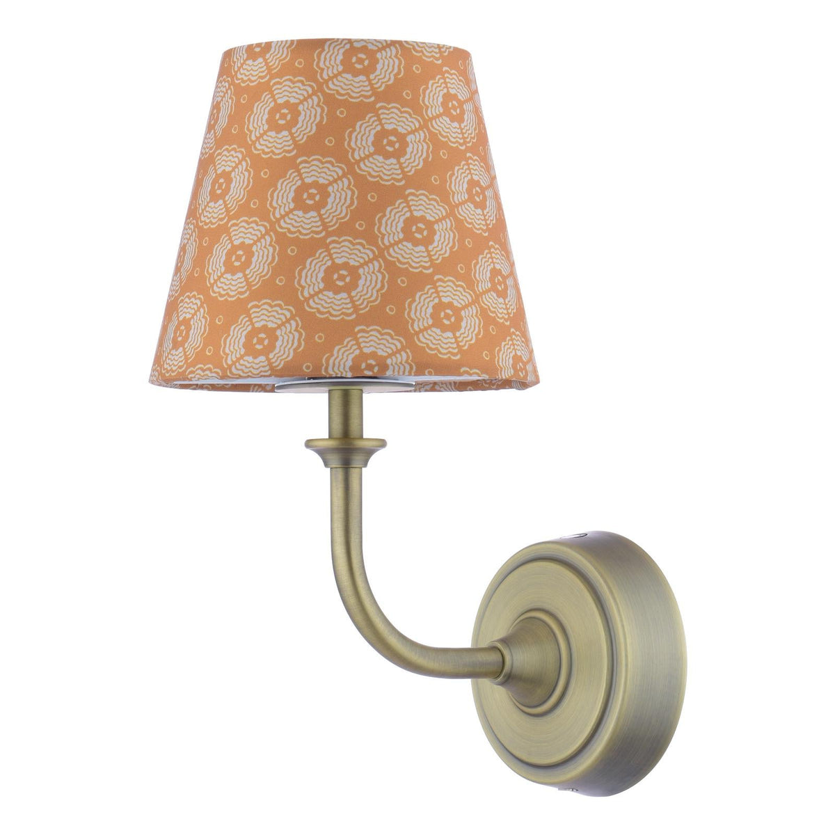 Wall sconce with antique brass finish and orange patterned fabric shade