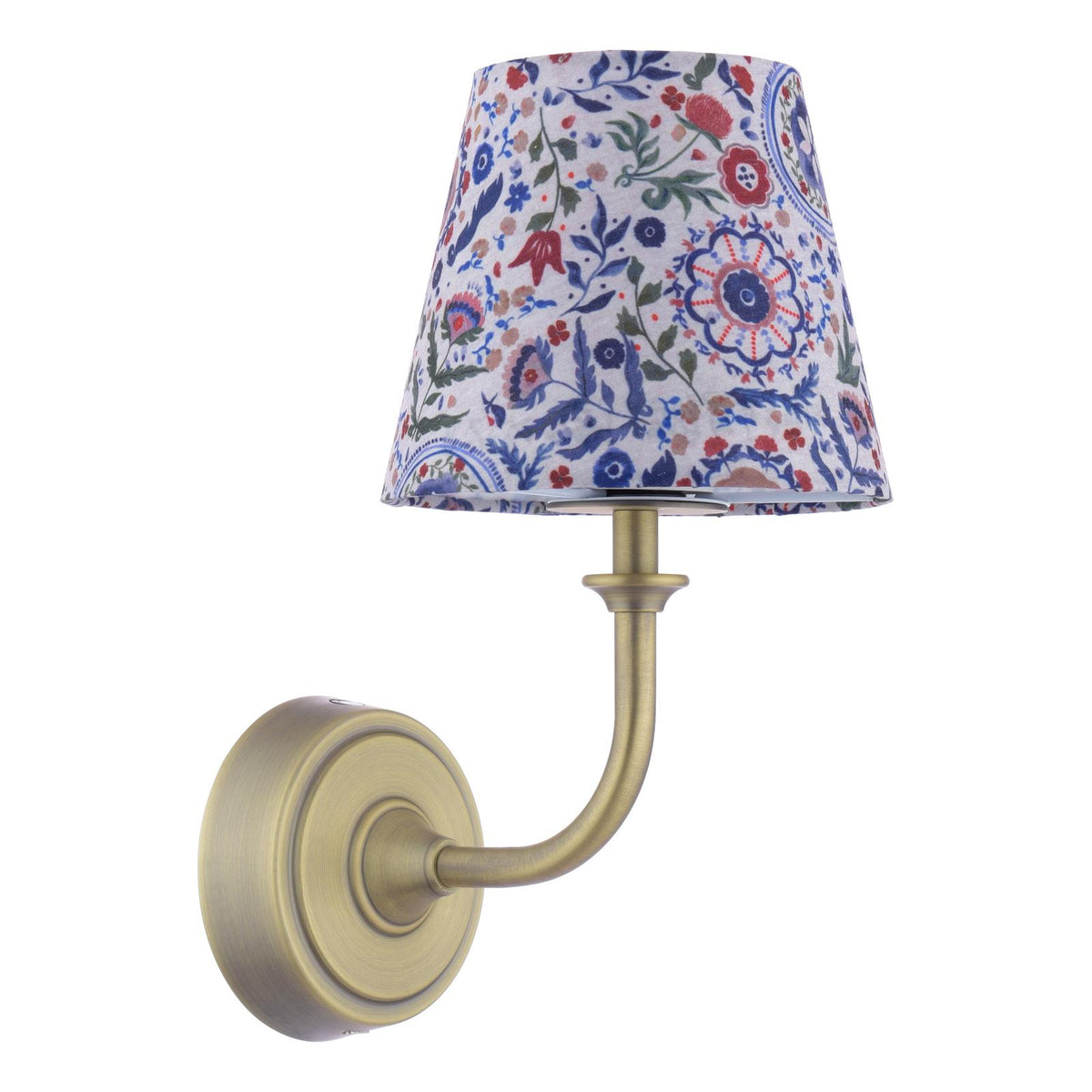 Wall lamp with a brass finish arm and a floral patterned fabric shade