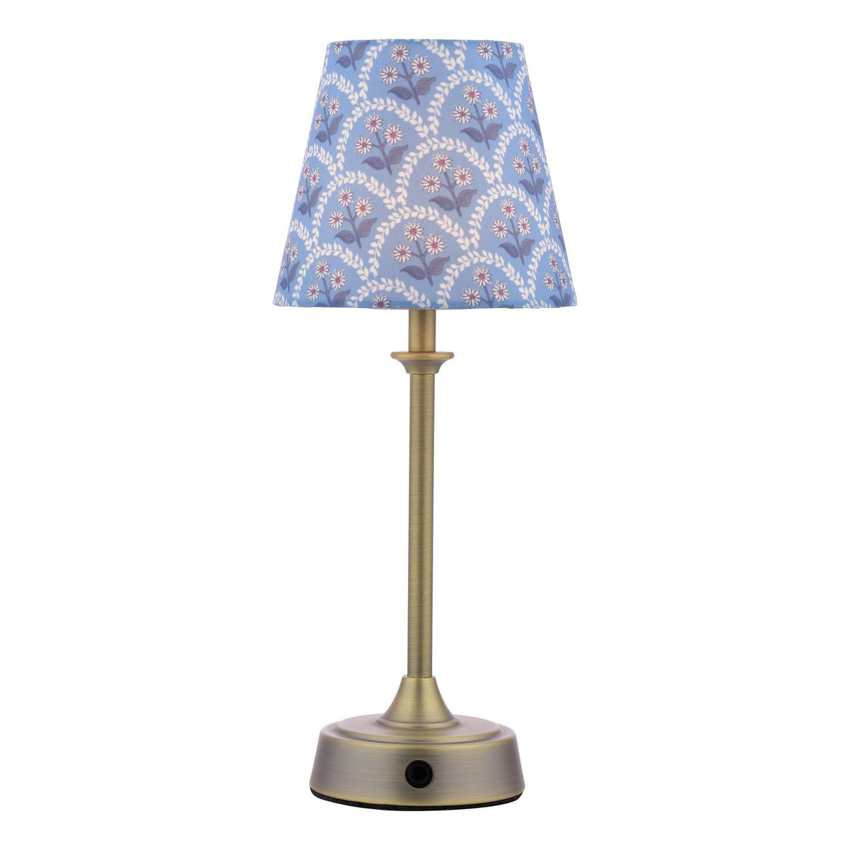 Table lamp with a brass base and a blue floral patterned fabric shade
