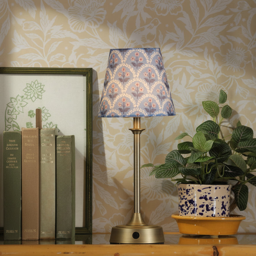Joules Apsley rechargeable table lamp in matt antique brass with a patterned blue cotton shade