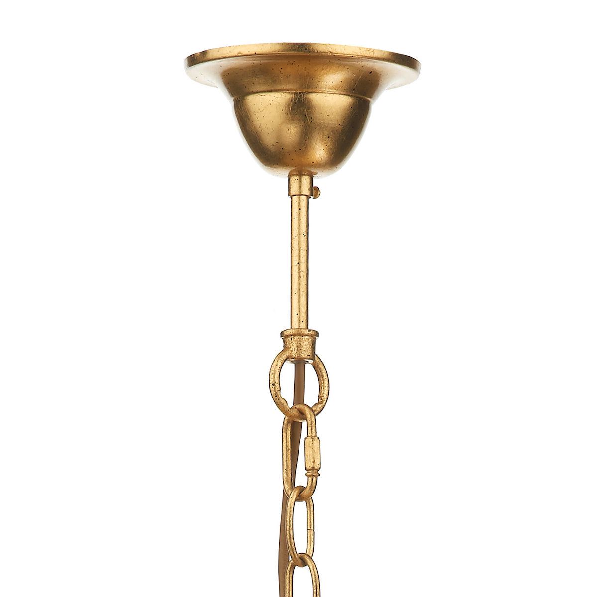 A close-up of a gold chandelier's ceiling mount, rod, and chain links.